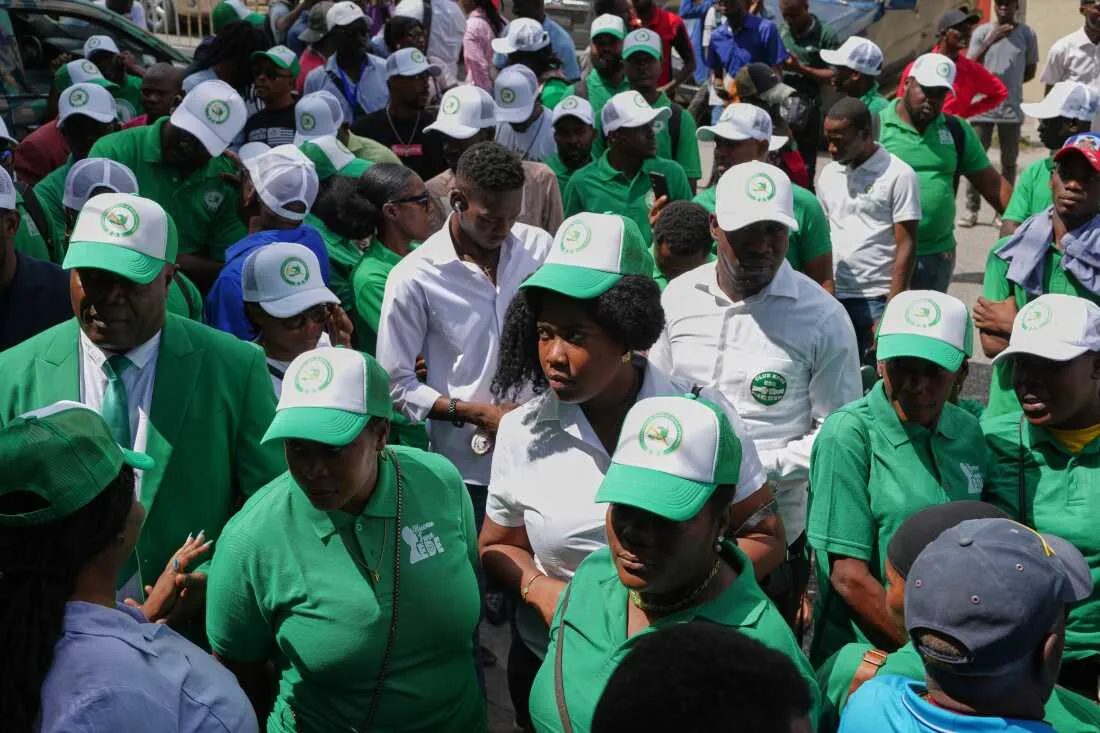 Members of the EDE (Committed to Development) political party arrive to register the party at the Provisional Electoral Council in the Petion-Ville neighborhood of Port-au-Prince, Haiti, Thursday, March 12, 2026.