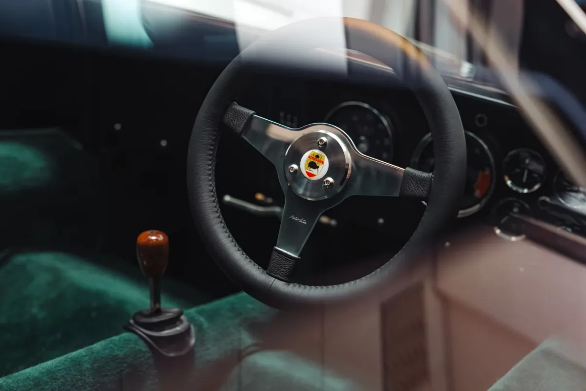 A passion project accurate in every way, including the turned solid walnut gear knob and racing green cockpit trim