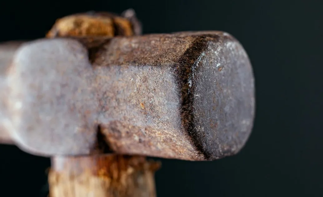 Neighbor's sledgehammer rescue saves trapped woman from burning home