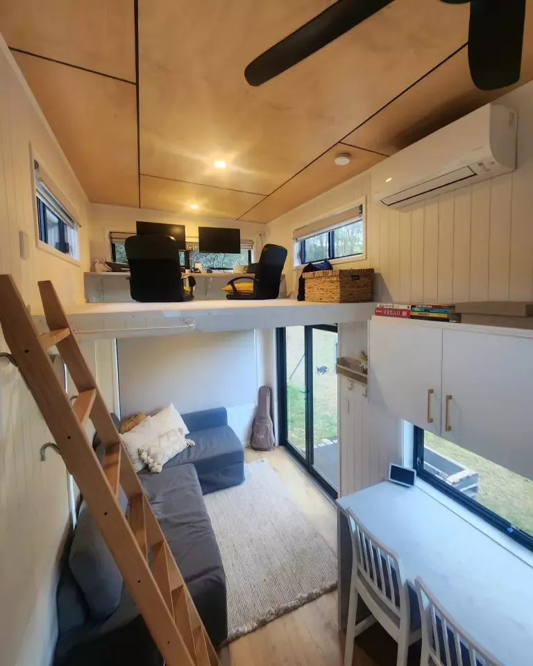 The Coolangatta 8.4's living room includes a large L-shaped sofa