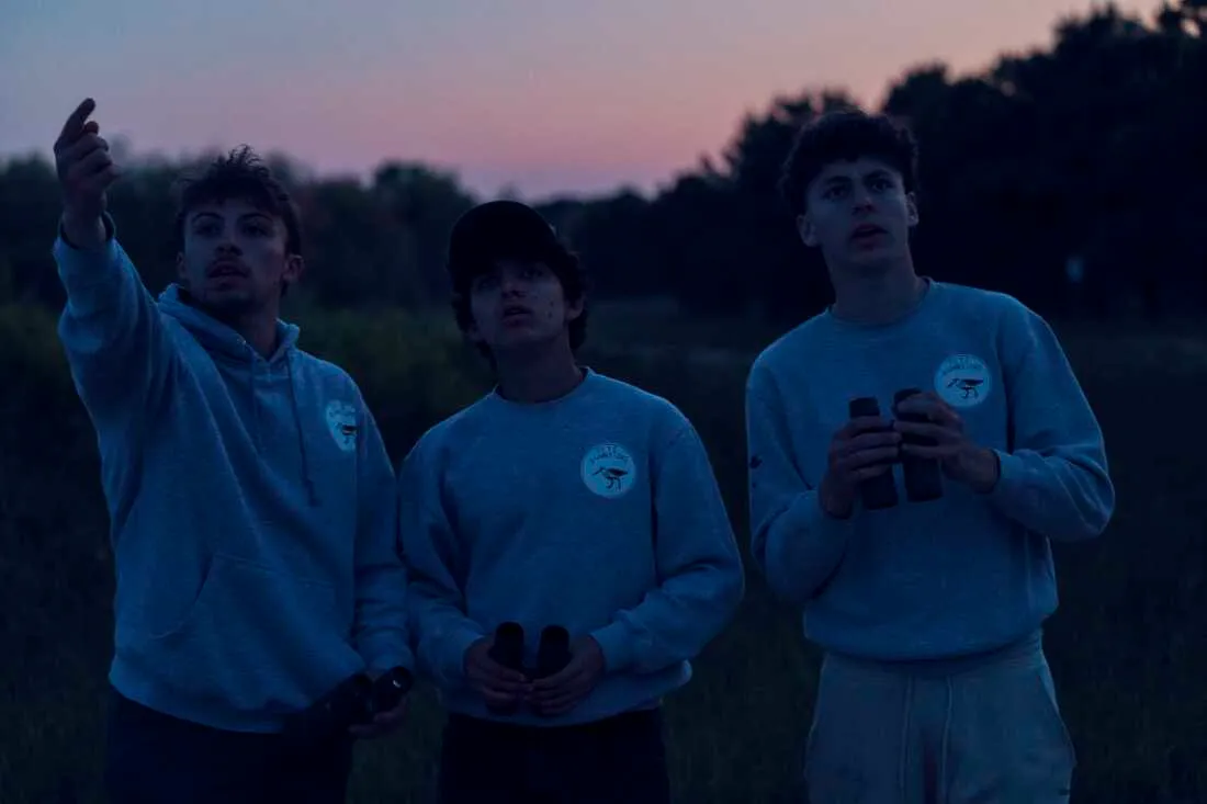 Trojan (left), Pacetti and Train look for a nighthawk at Edwin B. Forsythe National Wildlife Refuge after the sun set.