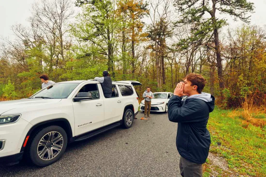 Trojan (right), makes bird calls at High Point State Park in northern New Jersey.
