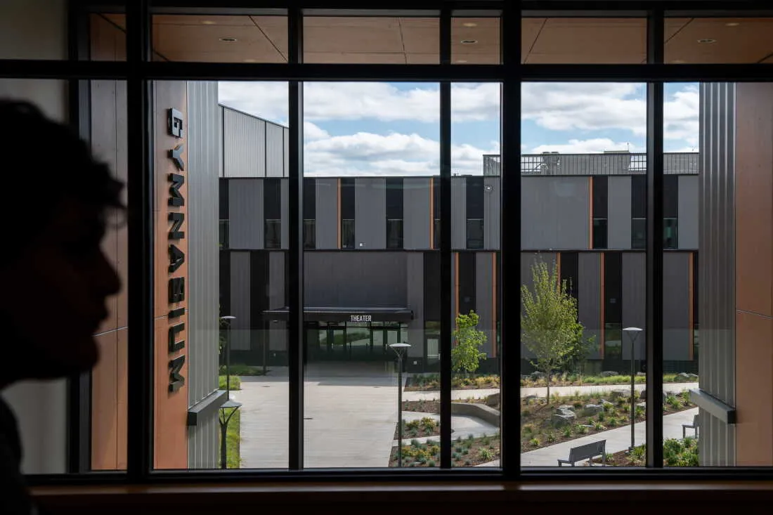 A student walks by a window opening up to the courtyard at the newly rebuilt Beaverton High School on the first day of the 2026-27 school year.