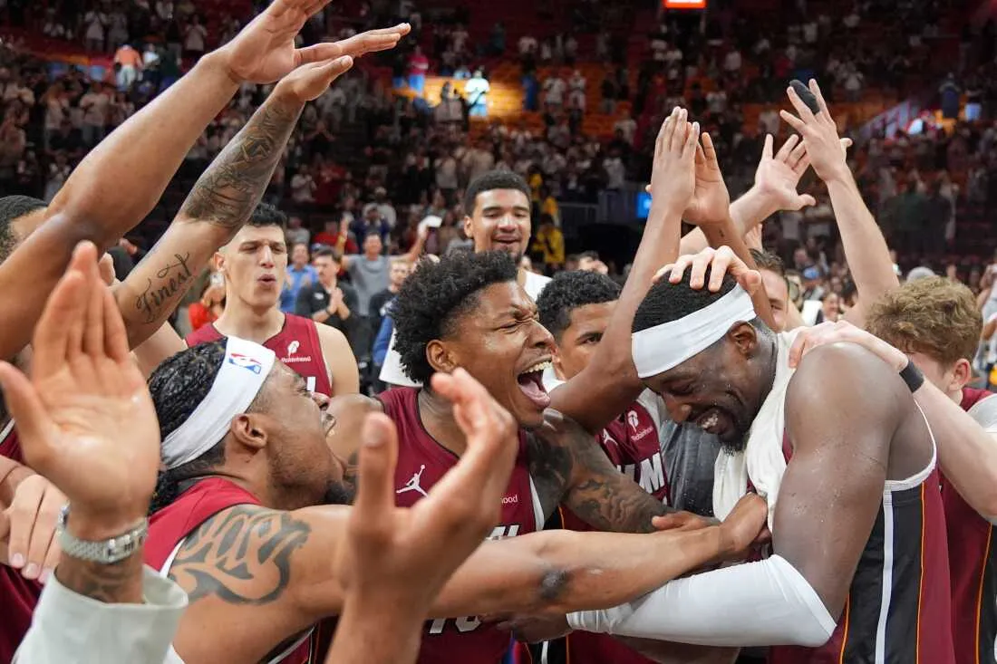 Miami Heat teammates celebrate center Bam Adebayo, right, after he scored 83 points, the second-highest single game total in NBA history, in an NBA basketball game against the Washington Wizards, Tuesday, March 10, 2026, in Miami.