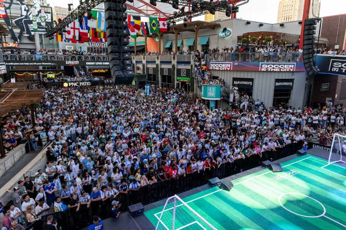 Soccer fans watch the World Cup football match between Argentina and Algeria at the Power & Light District in Kansas City, Missouri on June 16.