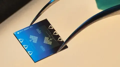 A blue computer chip from Alice & Bob