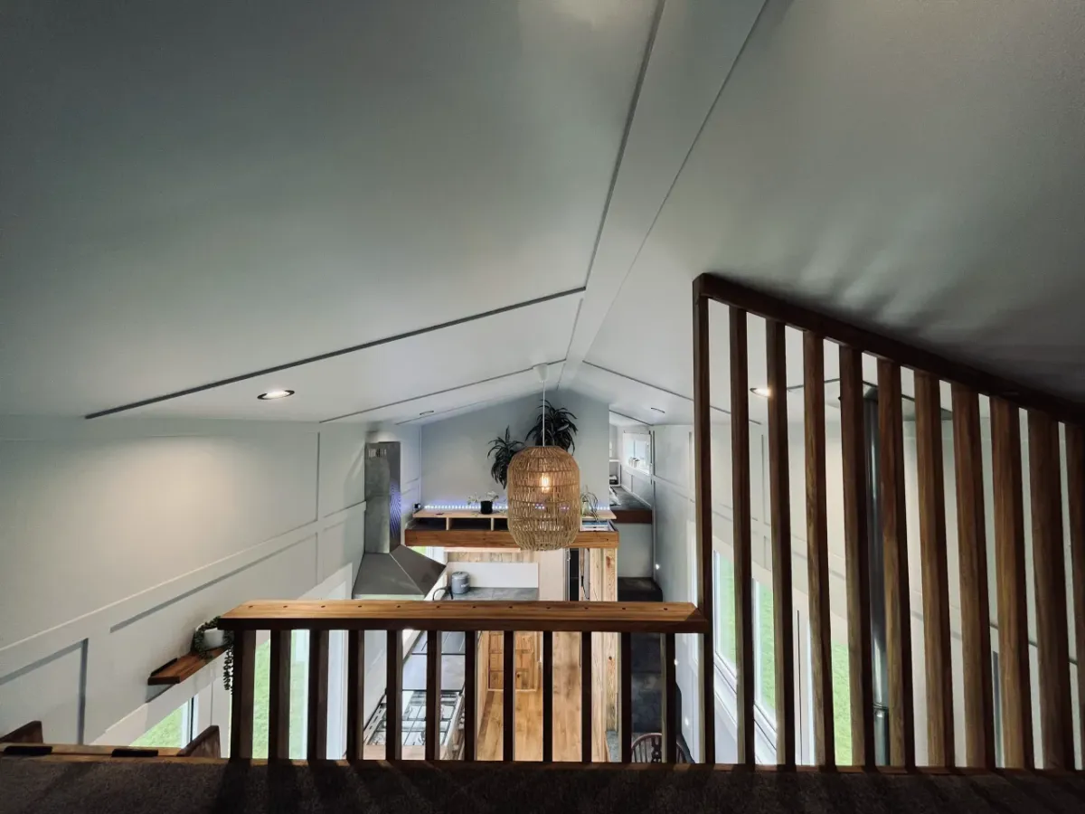 The Maple's secondary bedroom is reached by a wooden ladder and has an attractive wooden railing
