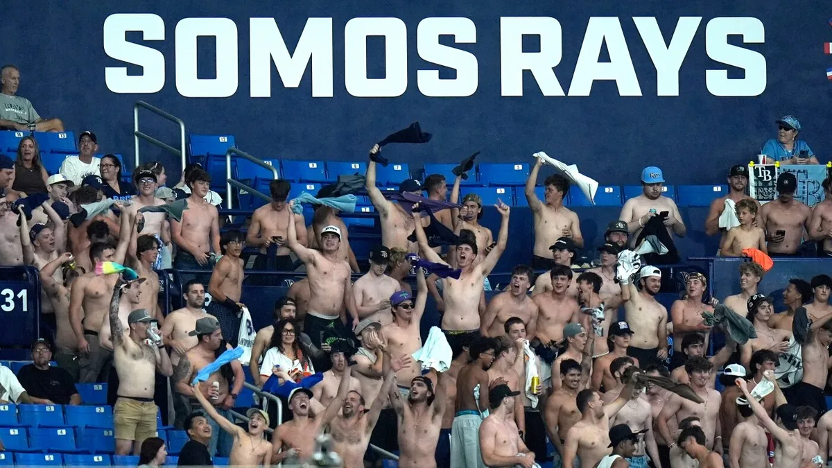 Shirtless fans cheer at MLB stadiums as "Tarps Off" trend sweeps baseball world