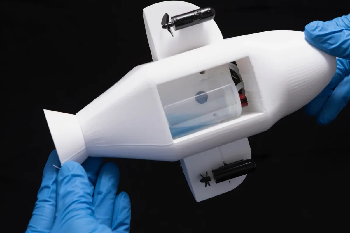 In a lab test pictured here, the collection chamber is partially filled with blue kerosene collected in place of oil