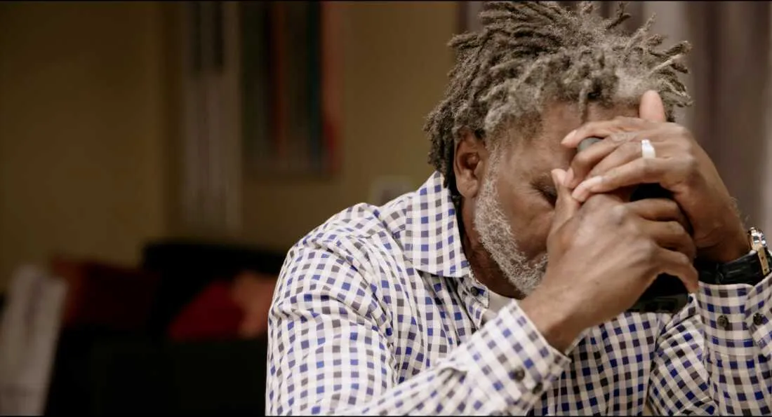 In 2020, Jacobs was denied a hearing to reduce his prison sentence. His father, pictured here, grapples with the news while trying to comfort his son.