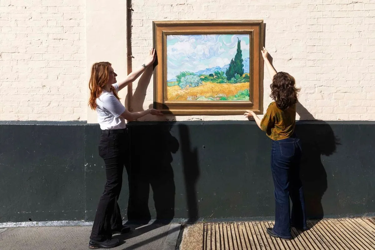 A reproduction of a painting displayed outdoors