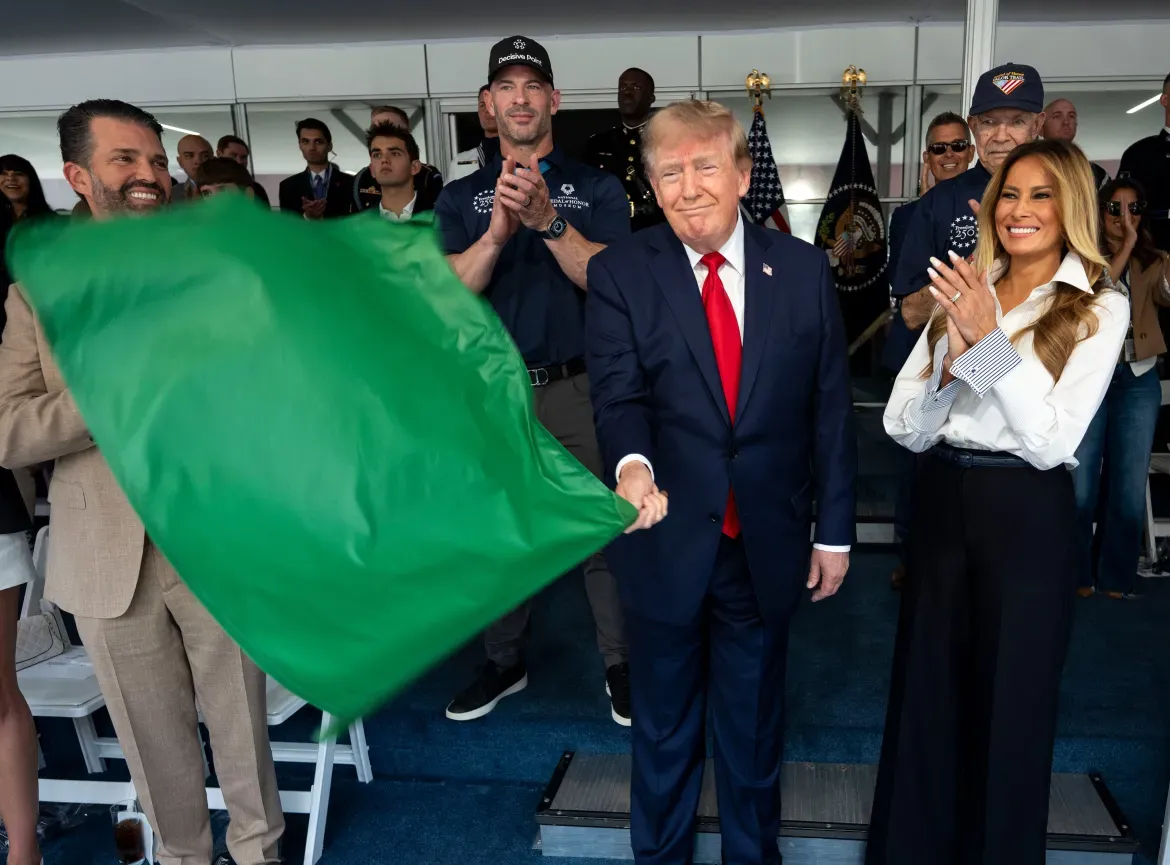 President Trump waves the green flag to start the race between first lady Melania Trump and Donald Trump Jr.