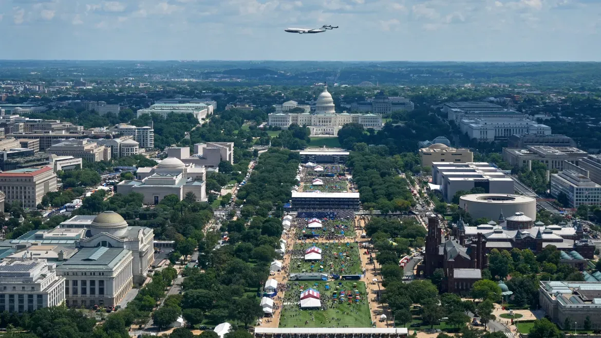 Air Force One flies over the US Capitol and the National Mall.