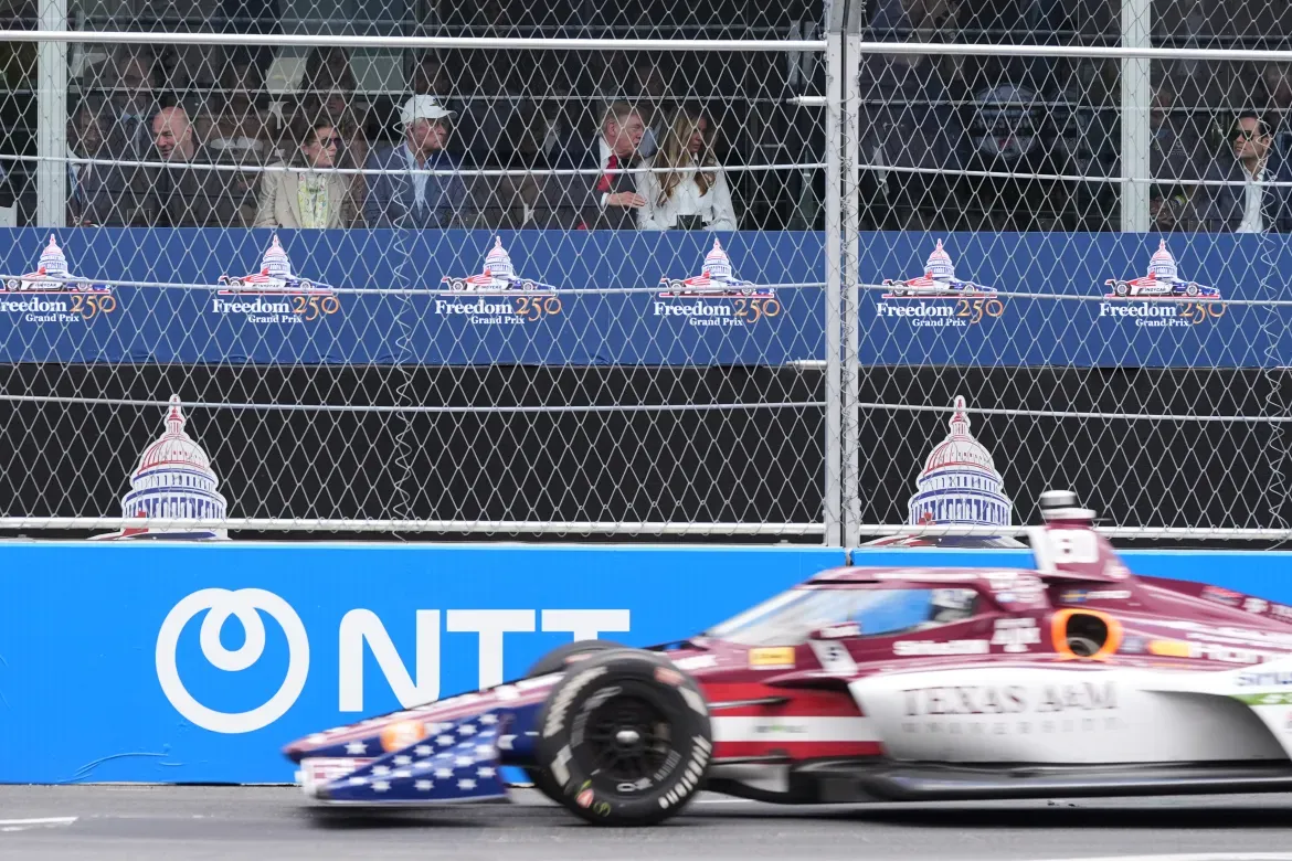 President Trump and Melania Trump watch the IndyCar Freedom 250 Grand Prix.