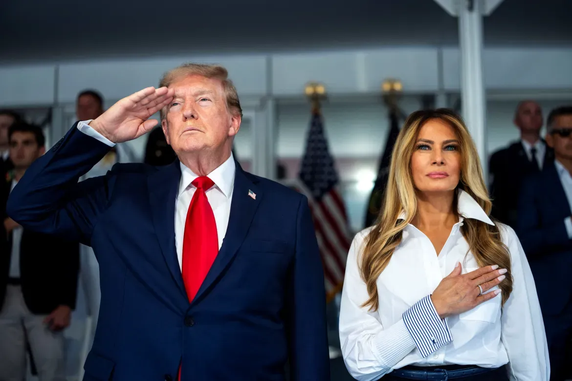 President Donald Trump with first lady Melania Trump during the US national anthem.
