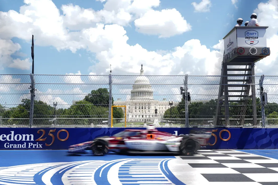 A driver passes in front of the US Capitol.