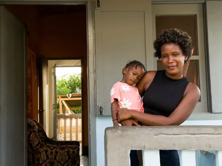 Clara Gomes at her house in a new village built by the Faya Foundation