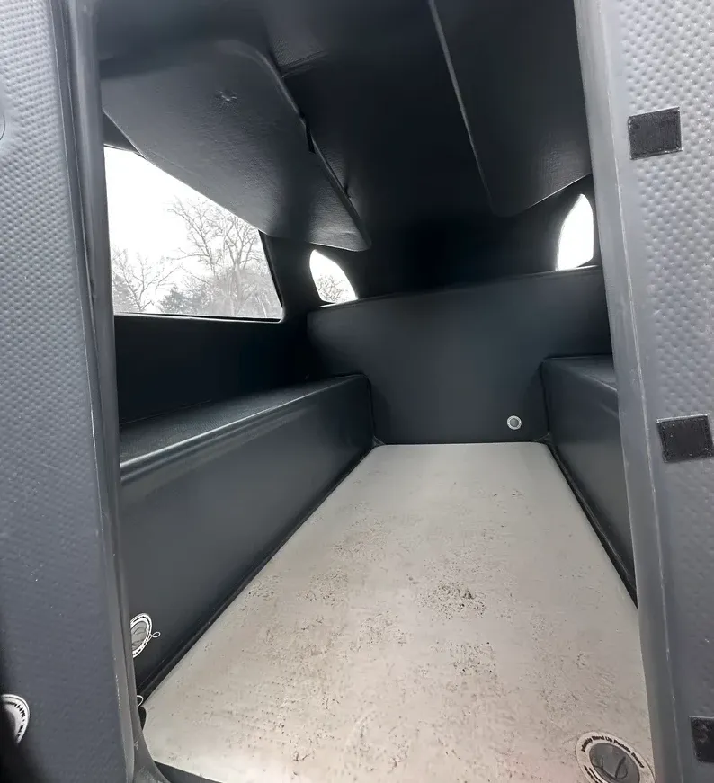 The grunginess of that floor mattress demonstrates why some might prefer to have a separate bench-top mattress for sleep. Up high, you can see the window shade panels that double as storage shelves