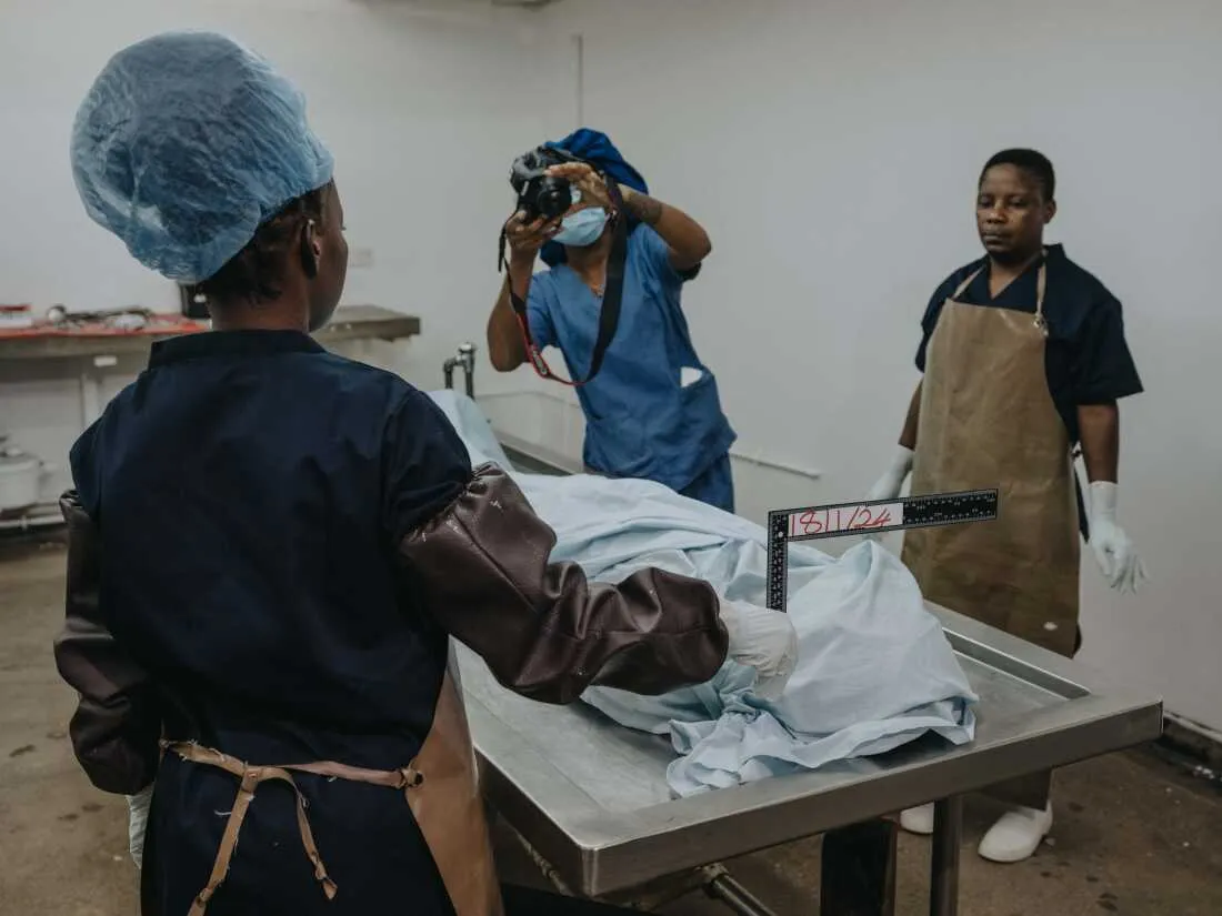 November 29, 2024. University Teaching Hospital, Lusaka, Zambia. Fellow forensic pathologists and support staff before commencing the day's medical-legal death investigations. MLDI program conducts medical investigations to determine causes of death as part of routine procedures.
Photo Credit: Juan Arredondo.