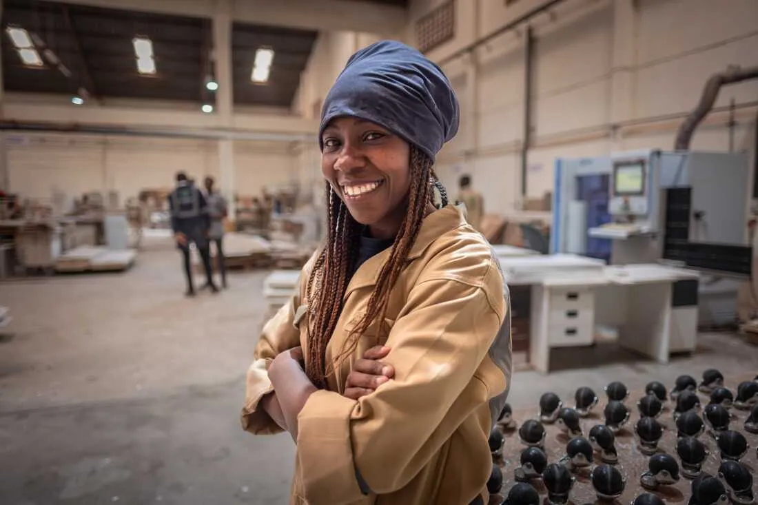 Diana Ojiambi, 24, photographed at her workplace in the Furniture International factory in Nairobi, Kenya. Ojiambo is one of several former buildher students who have found work with the company.