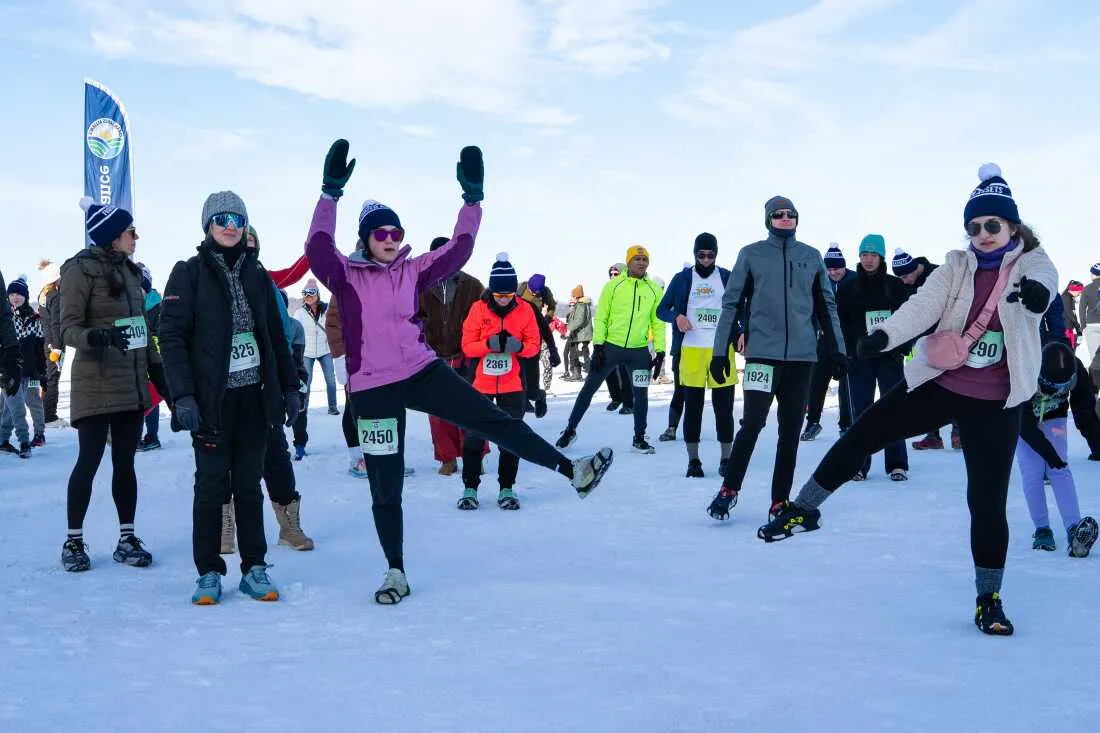 Runners warm up before the annual Frozen Assets Festival's 5K.