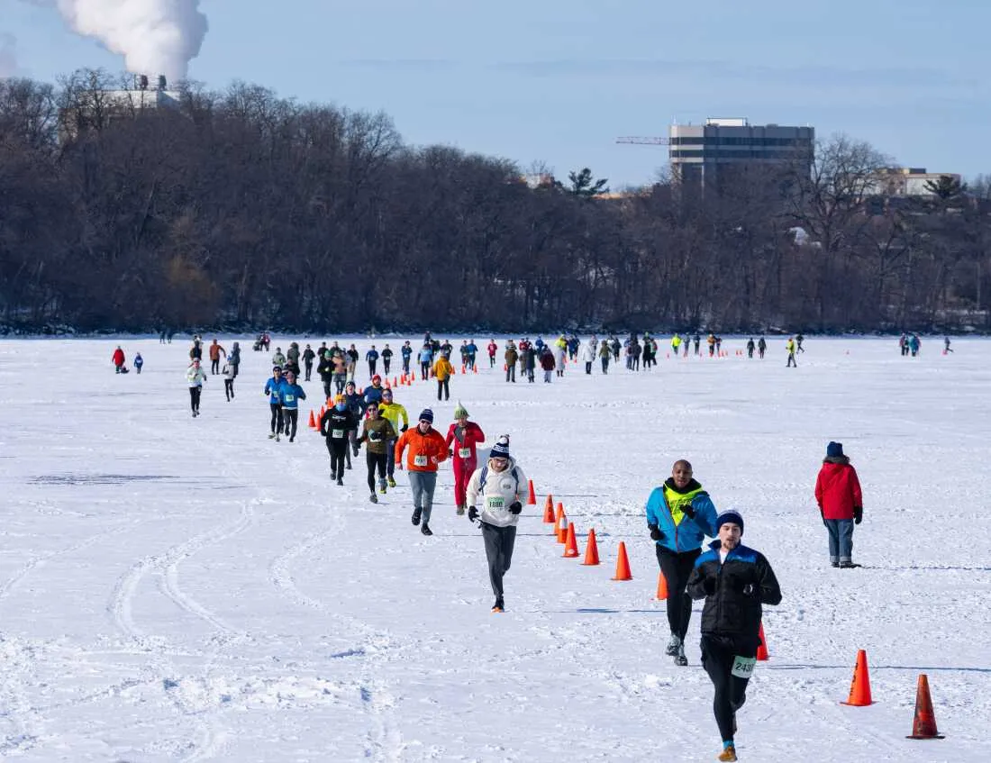 Competitors run on Lake Mendota in Madison, Wis., during the annual Frozen Assets Festival's 5K on Saturday, Feb. 7.