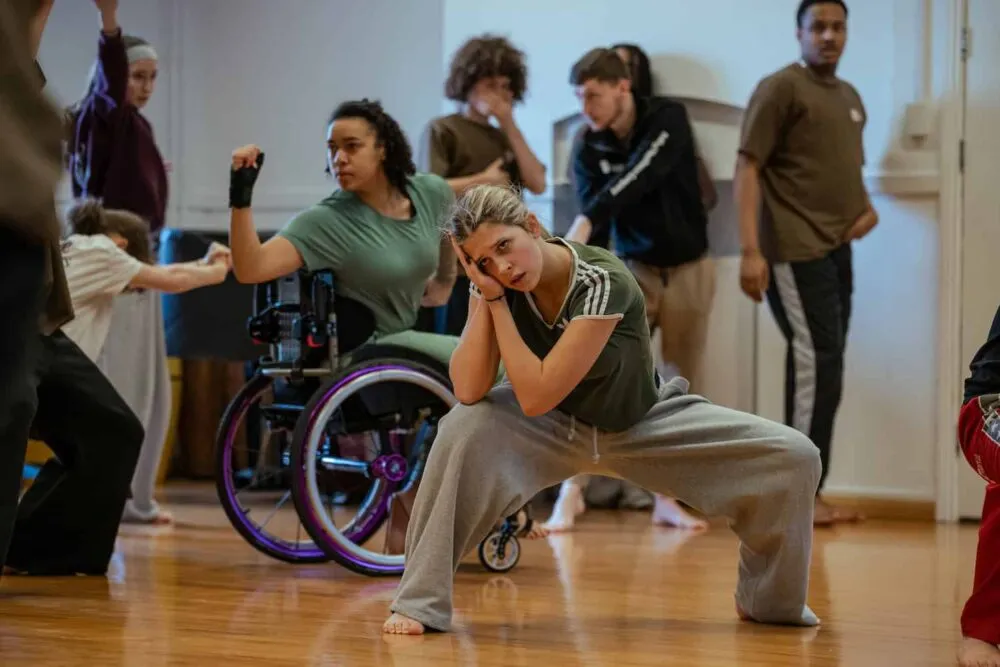 Dancers perform on stage