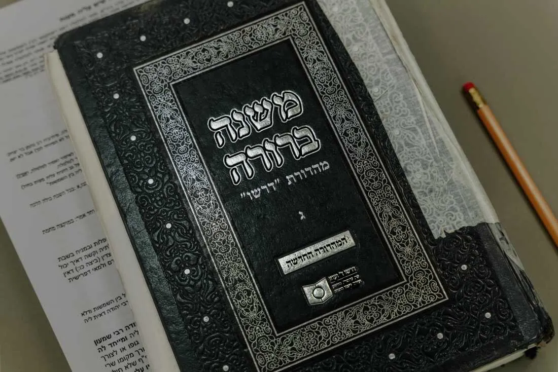 A copy of Mishnah Berurah, a widely used Orthodox Jewish religious text, sits in a classroom during a women’s study session at Matan in Ra’anana.