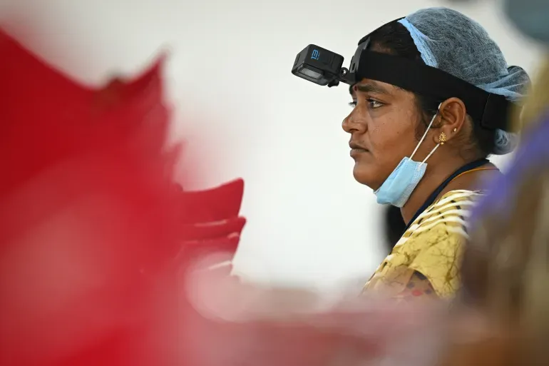 A worker wearing a camera on her head at a factory in Tamil Nadu’s Karur district.
