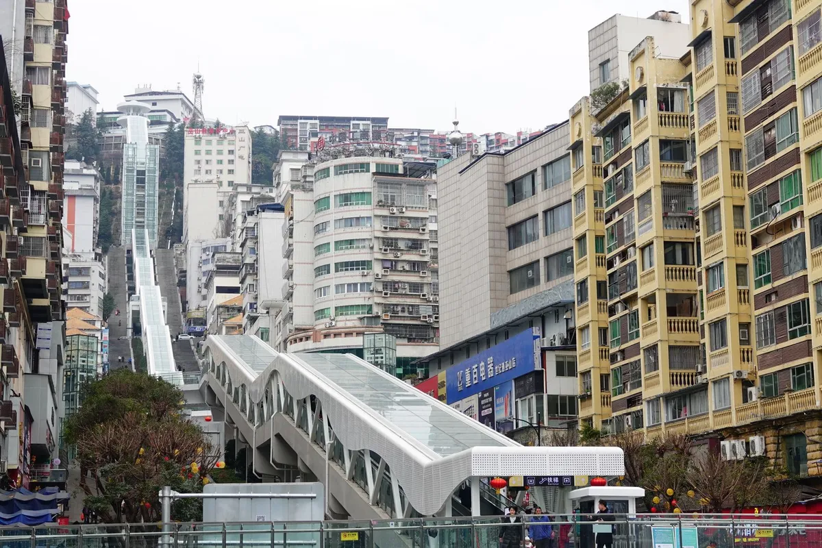 The World's Longest Outdoor Escalator Just Opened in China. Riding the 3,000-Foot-Long System to the Top Takes More Than 20 Minutes