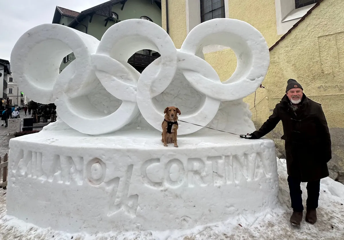 Deep in the Dolomites, a UC Berkeley professor and his service dog carry the Olympic flame