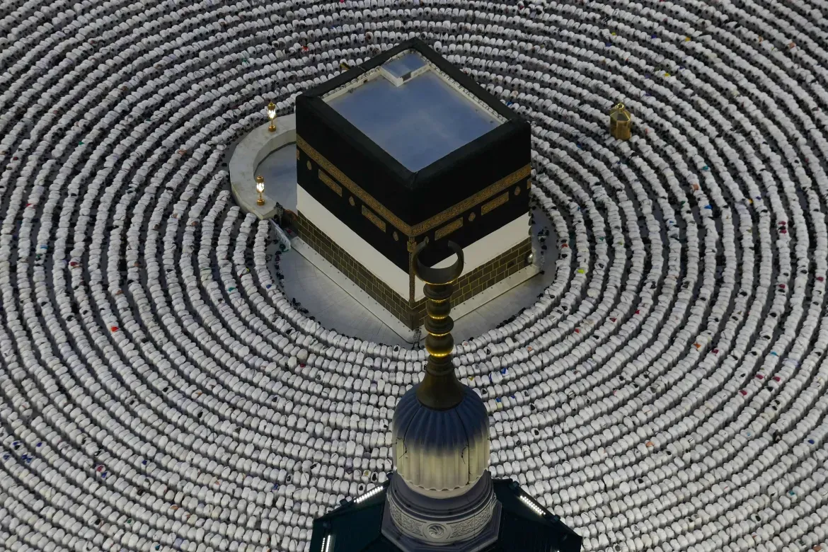 Muslim pilgrims prostrate as they offer evening prayers around the Kaaba, Islam's holiest site in the holy city of Mecca.