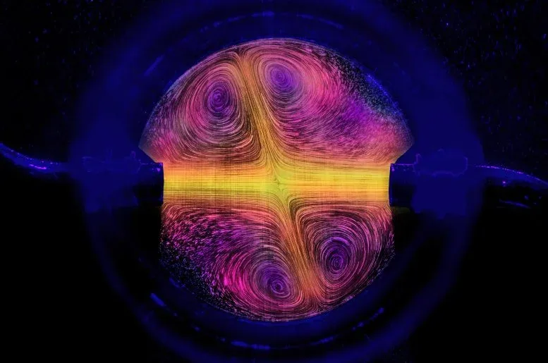 Water flows into a reverse sprinkler, visualized with particles and false colors.