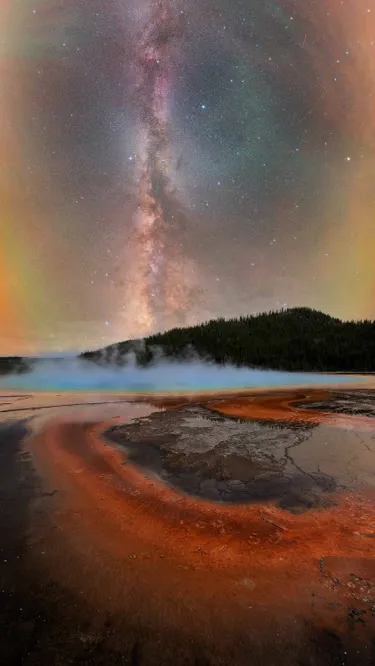 FirewaterAt the Grand Prismatic Spring in Yellowstone national park, US, the raw energy of the planet meets the quiet vastness of the night sky. The constantly shifting steam transformed the scene from one moment to the next, briefly revealing the stars before concealing them again.